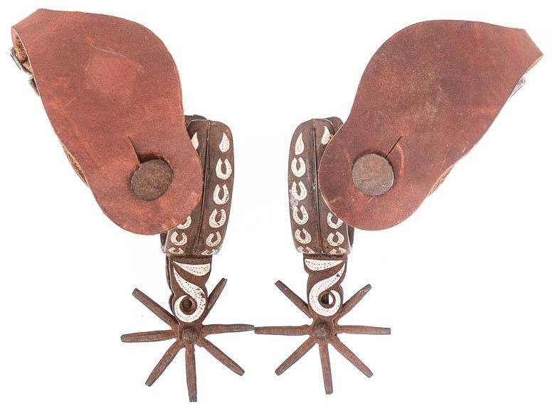 Mexican Chihuahua-Style Spurs: Provenance: An Alamo Heights, TX Estate Pair of Mexican Chihuahua-style spurs, leather straps, horse shoe motif