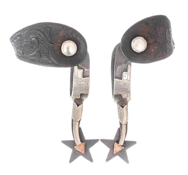 Mexican Shop-Made Spurs: Provenance: An Alamo Heights, TX Estate Pair of vintage Mexican shop-made spurs, longhorn and arrow motif, leather straps, star points, "Estados Unidos Mexicanos"