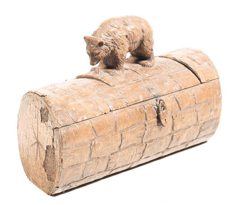 Bear on Log Trinket Box: Provenance: The Estate of Andy and Bea Copeland Carved wooden box in the shape of a log with a bear on the lid, hinged lid, with small metal lock in the shape of a heart 8" tall x 16" wide