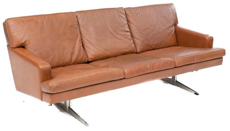 Mid-Century Danish Leather and Chrome Sofa: Mid-Century Danish sofa, brown leather, chrome frame 27" tall x 71" wide State-wide delivery is available for this item. Please email shipping@vogtauction.com or call 210-822-6155 for a quote. IN-HOUS