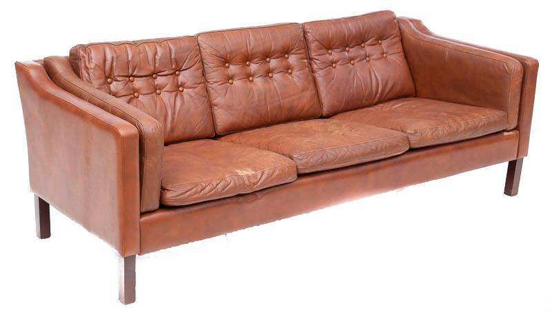 Mid-Century Danish Sofa: Mid-Century Danish sofa, buttoned accents, brown leather 27" tall x 75" wide Condition: Minor scuffs State-wide delivery is available for this item. Please email shipping@vogtauction.com or call 210-8