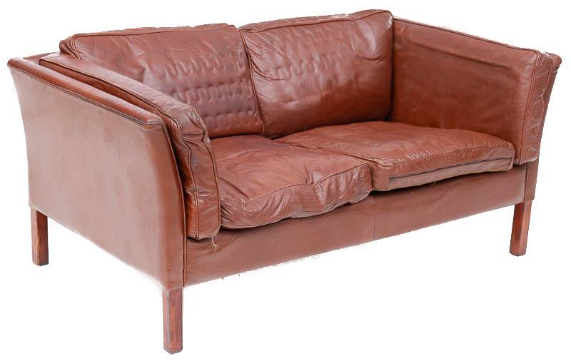 Mid-Century Danish Sofa: Mid-Century Danish sofa, brown leather, wooden legs 26" tall x 58" wide x 32" deep State-wide delivery is available for this item. Please email shipping@vogtauction.com or call 210-822-6155 for a quot