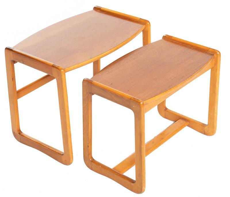 Pair of Nesting Mid-Century Teak Tables: Pair of nesting Mid-Century teak tables 18" tall x 22.5" wide x 14.5" deep/ Largest State-wide delivery is available for this item. Please email shipping@vogtauction.com or call 210-822-6155 for a quo
