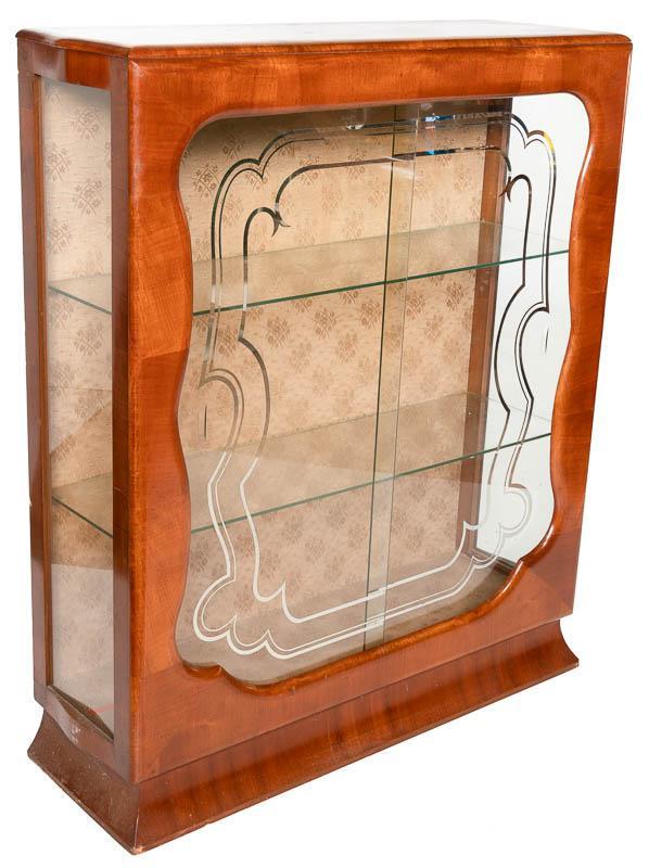 Art Deco Display Case: Art Deco display case, etched glass accents, scrolled art deco motif, 2-sliding glass doors 46" tall x 38" wide x 12.5" deep State-wide delivery is available for this item. Please email shipping@vogta