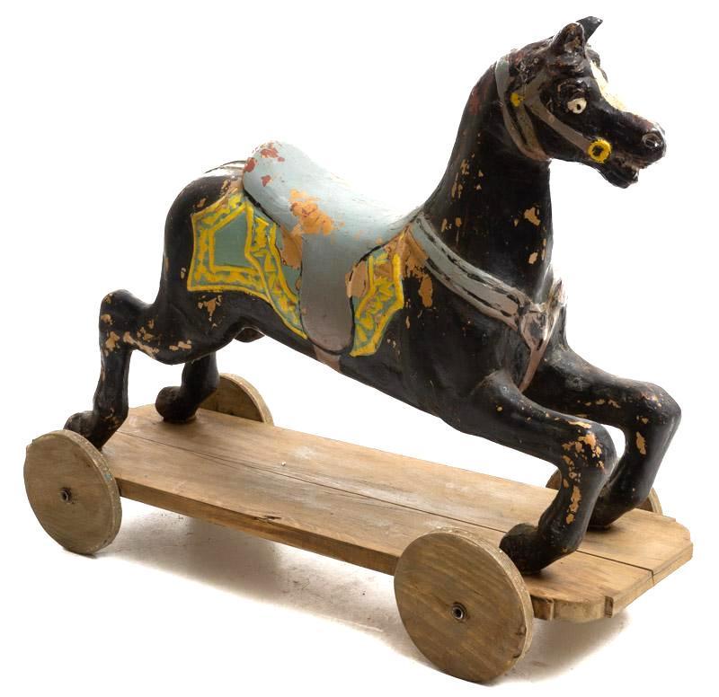 Vintage Rocking Horse: Vintage rocking horse, on wheels, paint remnants 30" tall x 38" wide State-wide delivery is available for this item. Please email shipping@vogtauction.com or call 210-822-6155 for a quote. IN-HOUSE SH