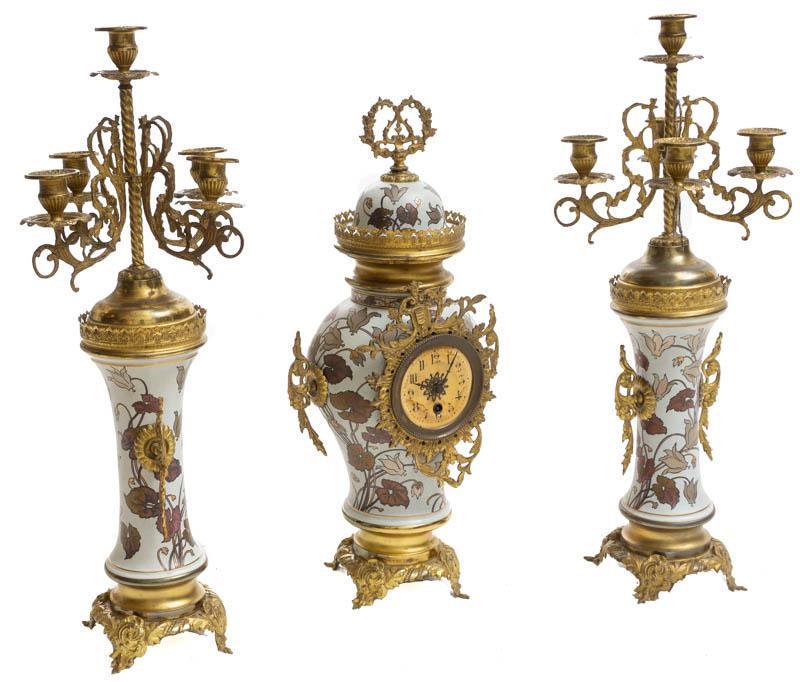 French Empire-Style Clock Garniture Set: French Empire-style clock garniture set, 2-candle holders, 1-clock, figural motif 25" tall x 5.5" wide/ Largest State-wide delivery is available for this item. Please email shipping@vogtauction.com or
