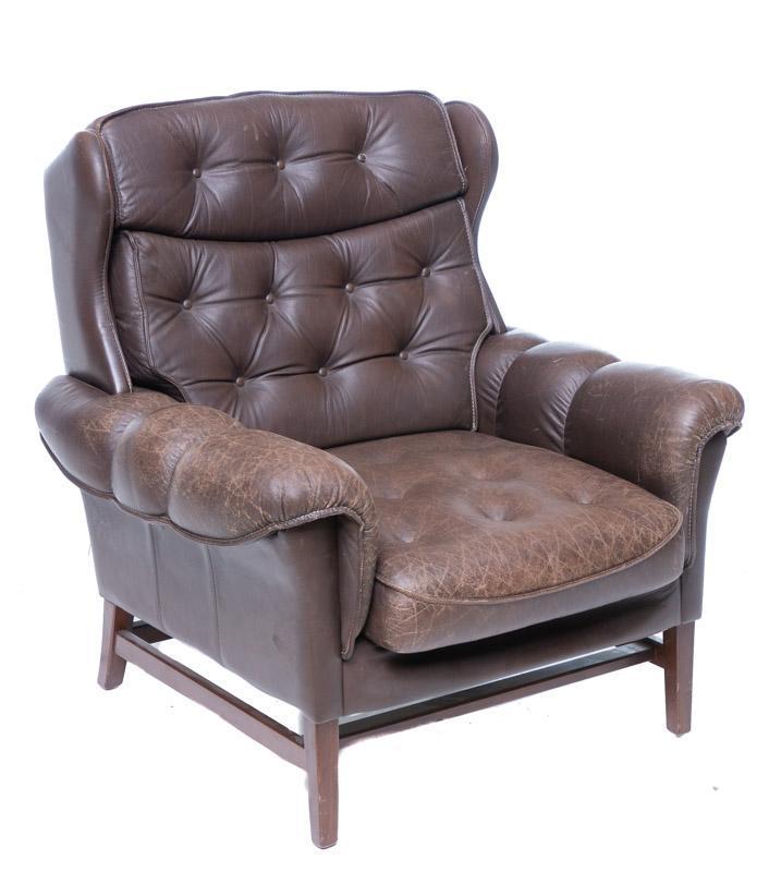Mid-Century Danish Arm Chair: Mid-Century Danish arm chair, button back, wood legs 36.5" tall x 36" wide x 31" deep Condition: Minor cracks, tear in back corner State-wide delivery is available for this item. Please email shipping