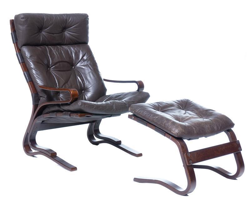Mid-Century Danish Leather Arm Chair and Footrest: Mid-Century Danish leather arm chair and foot rest, matching, button back 39.5" tall x 26.5" wide/ Chair 17" tall x 23" wide/ Footstool State-wide delivery is available for this item. Please email shi
