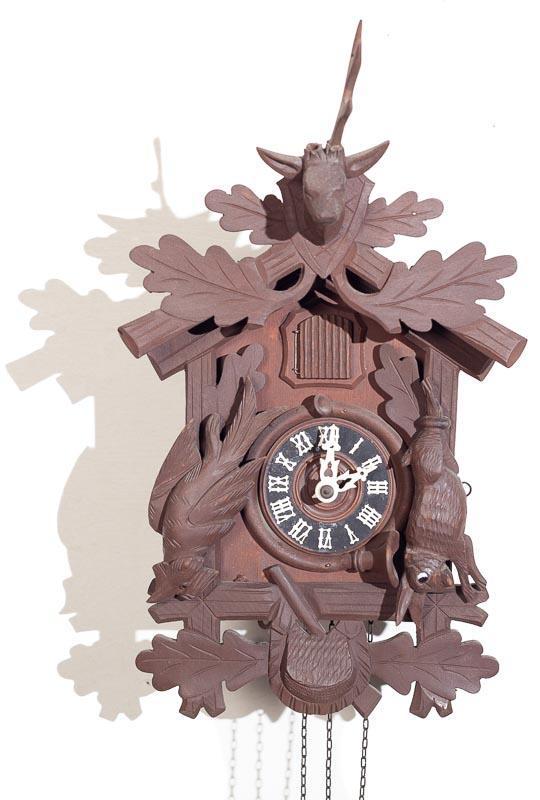 Cuckoo Wall Clock with Brass Plate Movement: Provenance: The Estate of Andy and Bea Copeland Cuckoo wall clock with brass plate movement 15” tall x 9” wide Condition: Missing antler Note: This antique clock is sold "where-is, as-is" 