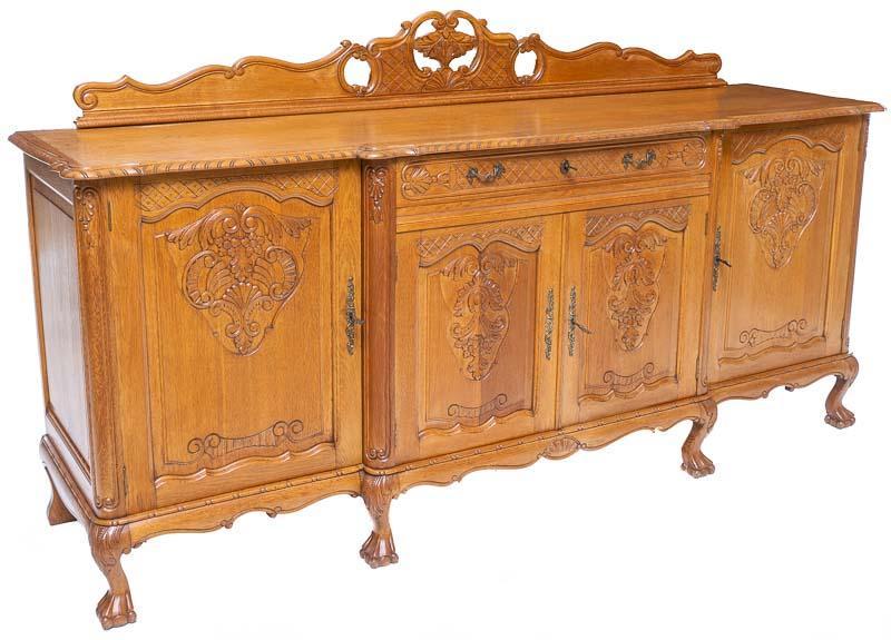 Louis XV-Style Sideboard: Louis XV-style sideboard, carved mantle, claw and ball feet, carved floral accents 37" tall x 87.5" wide x 21.5" deep State-wide delivery is available for this item. Please email shipping@vogtauction.