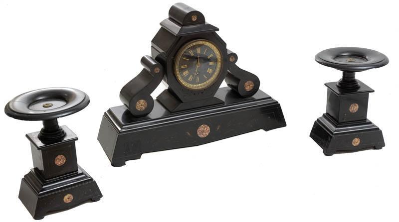 French Empire-Style Clock Garniture Set: French Empire-style clock garniture set, black man-made quartz accents, 2-candle holders, 1-clock 13" tall x 18" wide x 5" deep/ Largest Condition: As is Note: This antique clock is sold "where-is, as