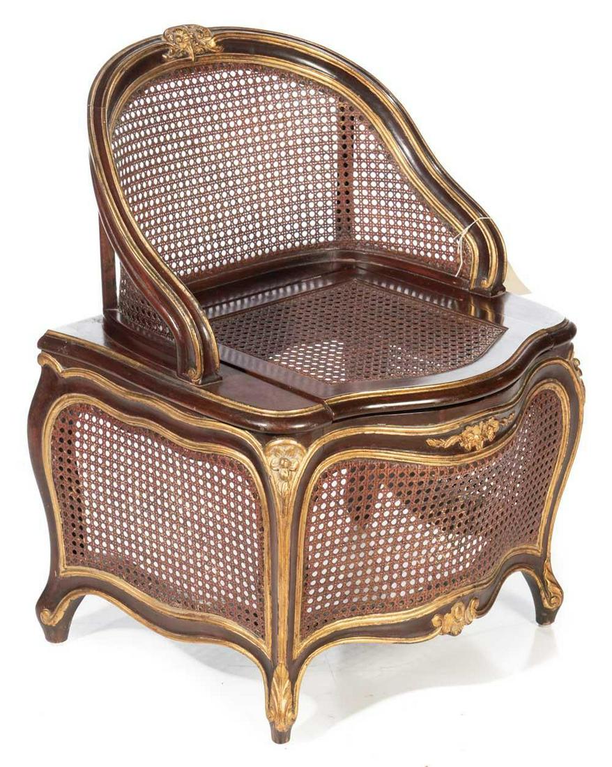 French Parcel Gilt Caned Chaise Percee: Provenance: The Estate of Linda McDougald French parcel gilt caned chaise percee, ornate accents 30” tall x 24” wide State-wide delivery is available for this item. Please email shipping@v