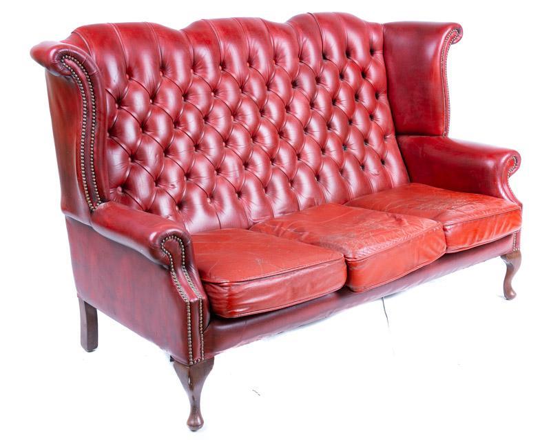 English Highback Chesterfield Sofa: English highback Chesterfield sofa, ox blood motif, button back 42" tall x 72" wide x 26.5" deep State-wide delivery is available for this item. Please email shipping@vogtauction.com or call 210-