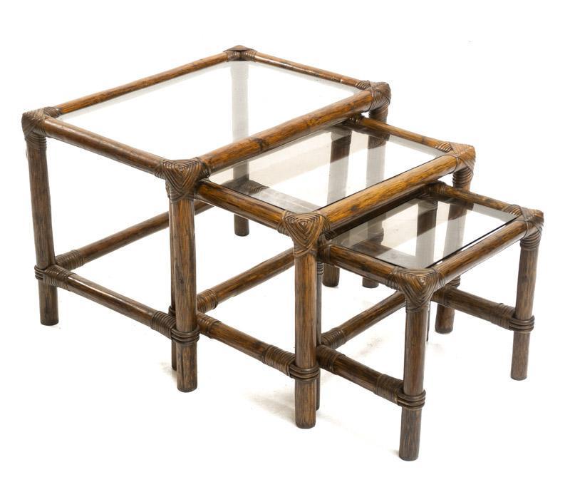 Nest of 3 Mid-Century Bamboo Glass-Top Tables: Nest of 3 Mid-Century bamboo glass-top tables, tinted glass, cross braced legs 18" tall x 24" wide x 17" deep/ Largest State-wide delivery is available for this item. Please email shipping@vogtauction