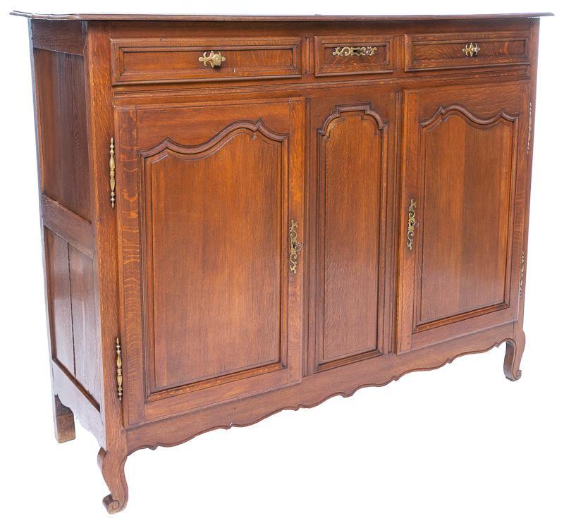 French Provincial-Style Oak Highboard: French Provincial-style oak highboard, 2 doors and 3 shelves, metal accents 55.5" tall x 20.5" wide x 22" deep State-wide delivery is available for this item. Please email shipping@vogtauction.com or 