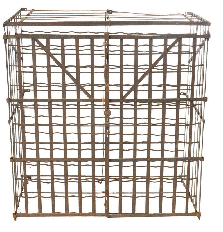 Spanish-Style Metal Wine Bottle Rack: Spanish-style metal wine bottle rack, with doors 43.5" tall x 40" wide x 22" deep State-wide delivery is available for this item. Please email shipping@vogtauction.com or call 210-822-6155 for a quote