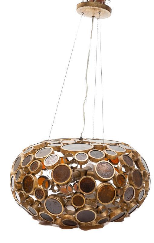 Mid-Century Atomic Brass and Amber Glass Chandelier: Provenance: A San Antonio, TX Estate Mid-Century Atomic brass and amber glass chandelier, flush mount, circular motif 14" tall x 22" diameter State-wide delivery is available for this item. Please ema