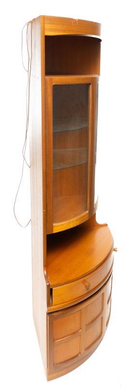 Mid-Century Nathan Curved Glass Display Case: Mid-Century Nathan curved glass display case, glass shelves, glazed doors, wooden drawer pulls, wired 76" tall x 28" wide x 21" deep State-wide delivery is available for this item. Please email shippi