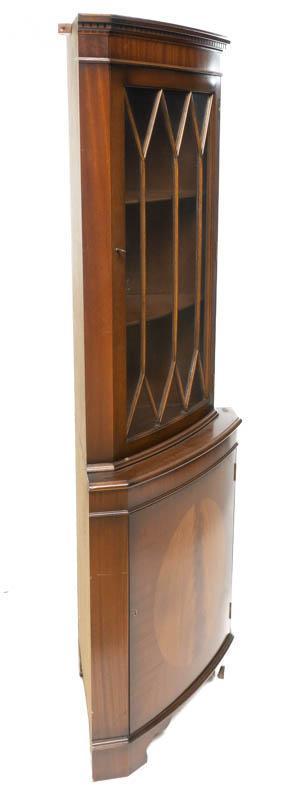 English Leaded Glass Corner Display Cabinet: English leaded glass corner display cabinet, veneer accents, includes key 71" tall x 26" wide x 16" deep Condition: Front heavy when doors are open, must be braced to wall State-wide delivery is avail