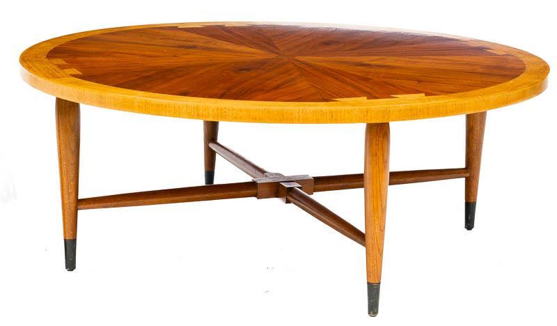 Mid-Century Lane Coffee Table: Mid-Century Lane circular coffee table, cross stretchered 15" tall x 38" diameter State-wide delivery is available for this item. Please email shipping@vogtauction.com or call 210-822-6155 for a quote