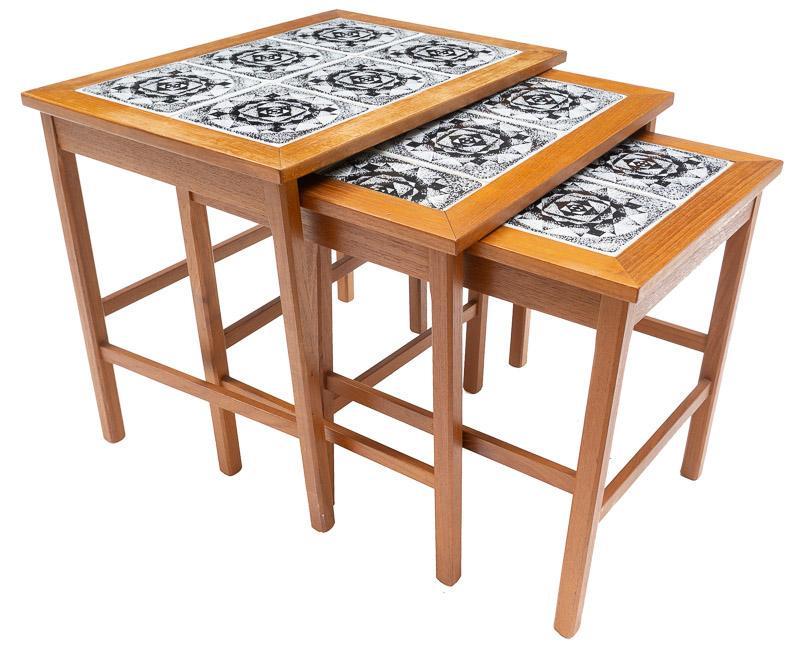 Mid-Century Nest of 3 Tile-Top Tables: Mid-Century nest of 3 tile-top tables, black and white abstract motif, wooden frames 19" tall x 21" wide x 15" deep/ Largest