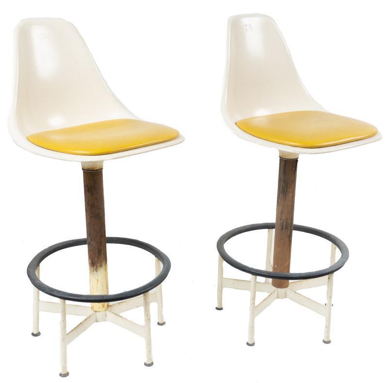Pair of Atomic Acrylic Bar Stools: Provenance: Charlott's Antiques of San Antonio, TX Pair of Atomic acrylic bar stools, mustard yellow faux leather seats, metal base 43" tall x 18" wide x 19" deep/ Each State-wide delivery is availabl