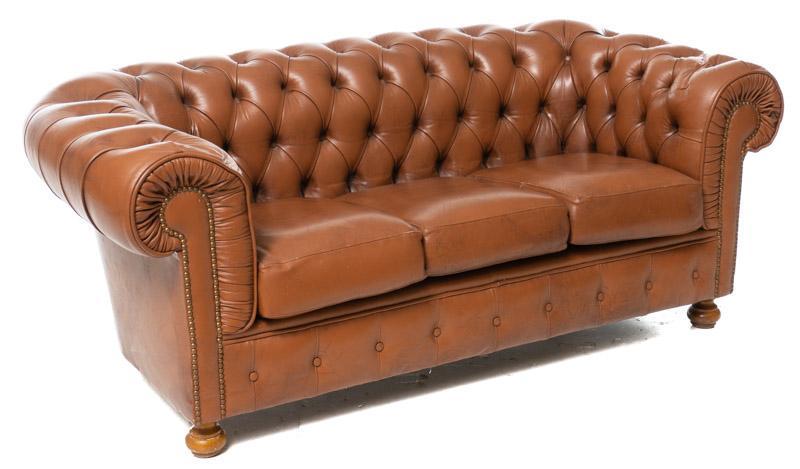Vintage English Chesterfield Leather Sofa: Vintage English Chesterfield leather sofa, button back, brown leather, bun feet 27.5" tall x 67" wide x 31" deep State-wide delivery is available for this item. Please email shipping@vogtauction.com o