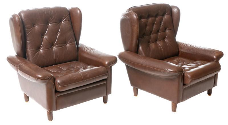 Pair of Mid-Century Leather Arm Chairs: Pair of Mid-Century leather arm chairs, wingback, button back 38" tall x 37" wide/ Each State-wide delivery is available for this item. Please email shipping@vogtauction.com or call 210-822-6155 for a