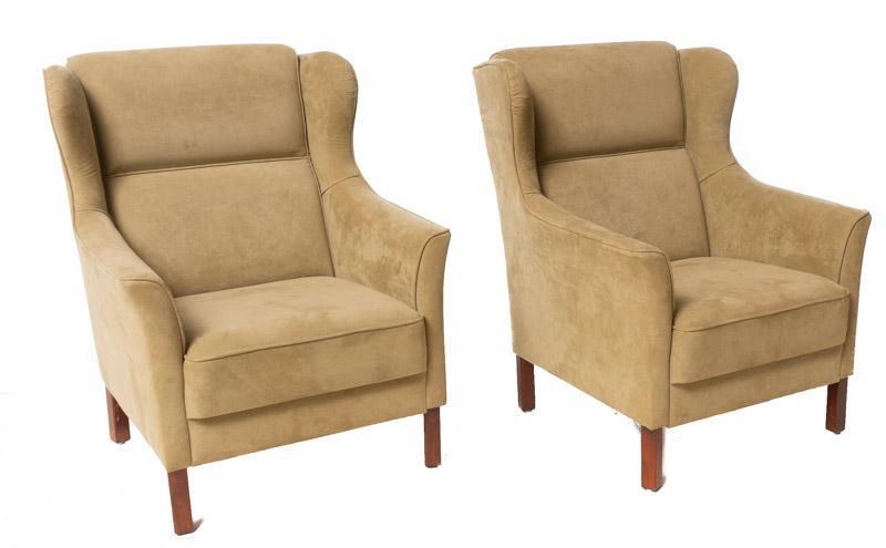 Pair of Mid-Century Suede Arm Chairs: Provenance: An Olmos Park, TX Estate Pair of Mid-Century suede arm chairs, tan, wooden legs, wingback 38.5" tall x 25.5" wide x 26" deep State-wide delivery is available for this item. Please email sh