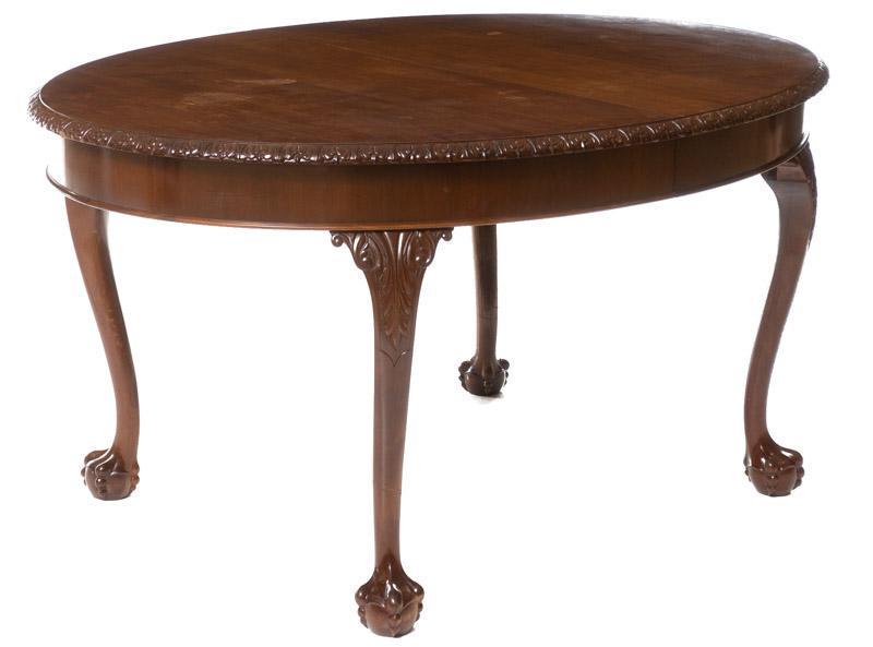 English Claw and Ball Dining Table: English claw and ball foot dining table, pie crust trim, carved accents 31" tall x 60" wide x 45.5" deep State-wide delivery is available for this item. Please email shipping@vogtauction.com or call 2