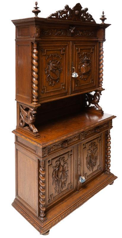 French Carved Saint Hubert-Style Hunting Buffet: French heavily carved Saint Hubert-style hunting buffet, 4-doors, 2-drawers, metal hardware, includes 2-keys, carved, barley twist, figural carving, 19th century 98" tall x 55.5" wide x 22" deep Condi