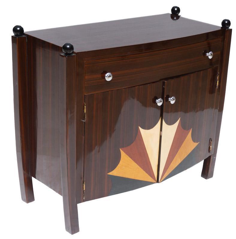 Art Moderne Sideboard: Art Moderne sideboard, chrome hardware, single-drawer, 2-doors, sunray motif 33" tall x 39" wide x 17.5" deep State-wide delivery is available for this item. Please email shipping@vogtauction.com or c