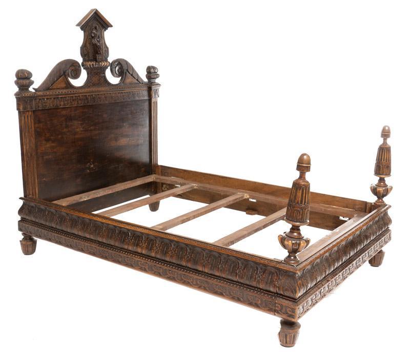 Medieval Gothic-Style Bed Frame: Medieval Gothic-style bed frame, 19th century, saint figural carving centerpiece on headboard 66" tall x 57" wide x 84" deep/ Frame size 50" wide x 76" deep/ Mattress size, European full Condition: Pr