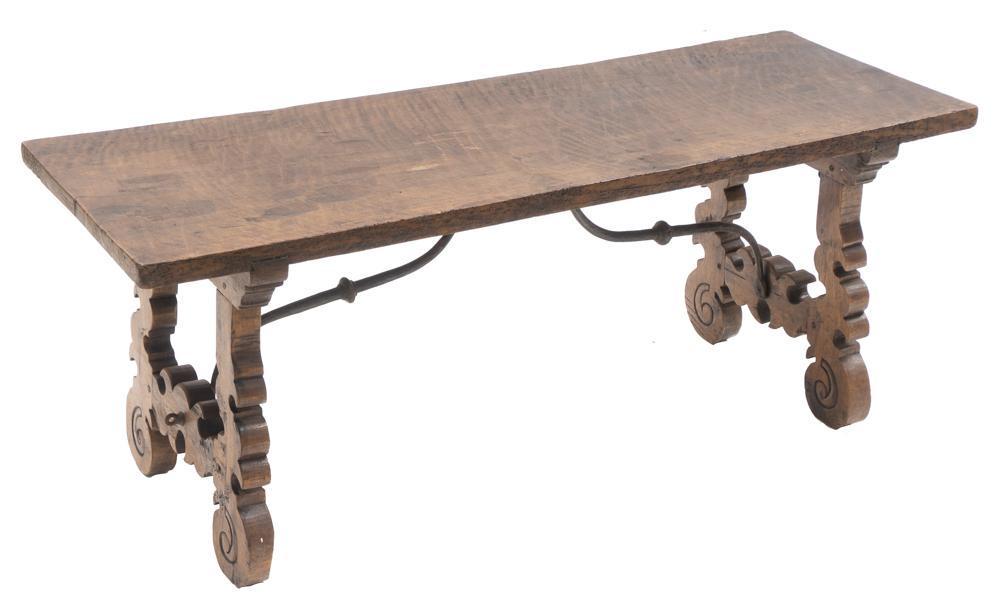 Spanish Renaissance-Style Coffee Table: Spanish Renaissance-style coffee table, carved lyre motif, iron accents, oak 19" tall x 49" wide x 17" deep State-wide delivery is available for this item. Please email shipping@vogtauction.com or cal