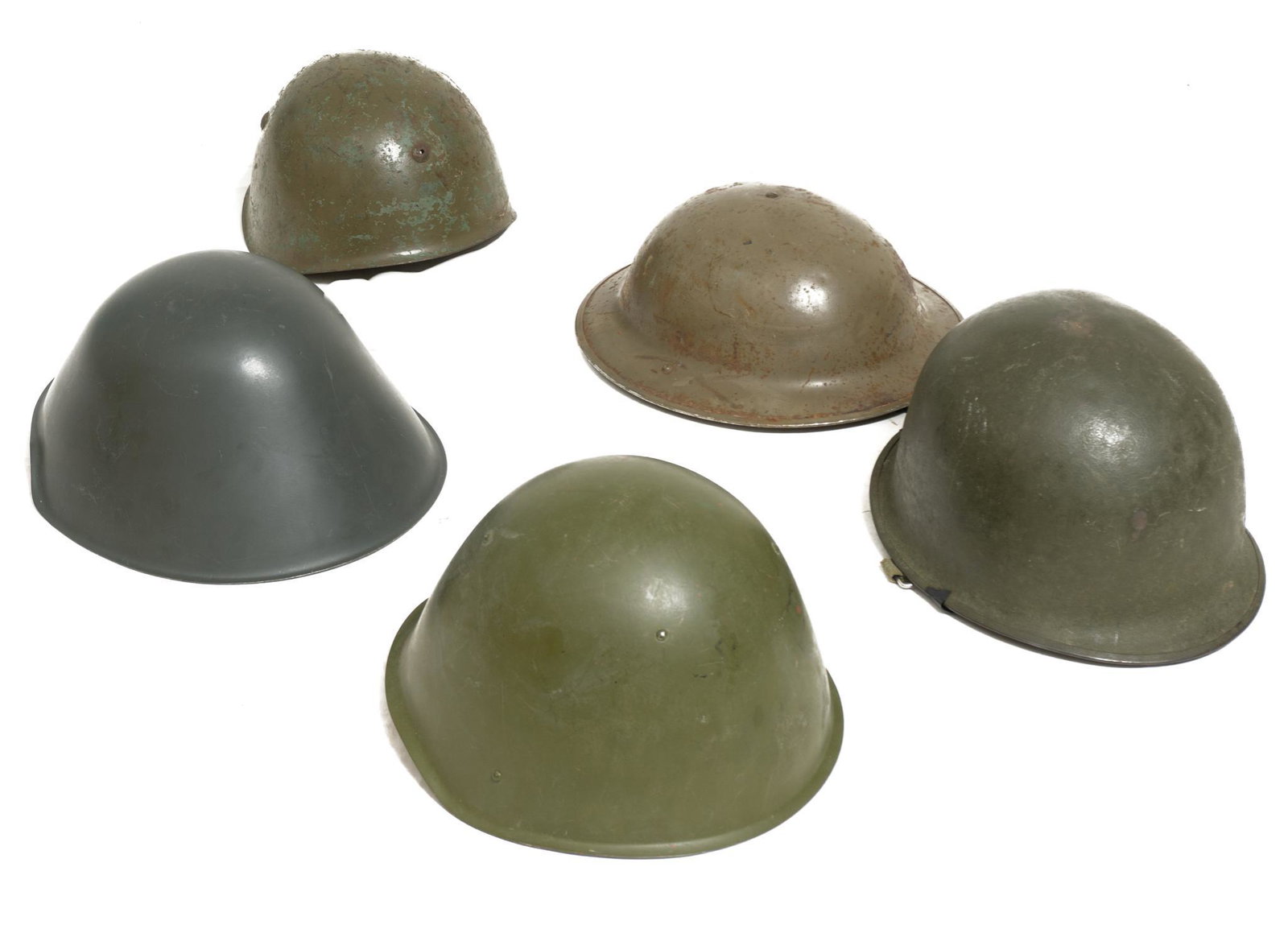 Lot of 5 Military Helmets: from US, Belgium, USSR, East Germany and Italy Provenance: Schertz, TX Estate In-house nationwide shipping and statewide (Texas) delivery is available on this item. Please email shipping@vogtauction.c