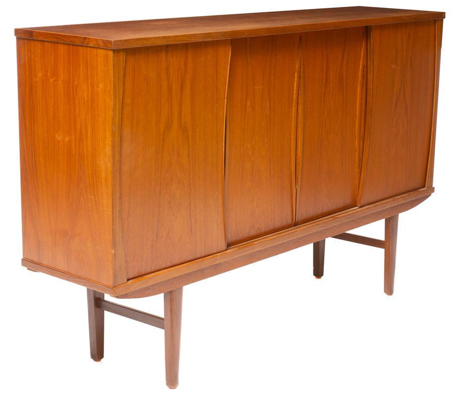 Danish Mid-Century Sideboard: Danish Mid-Century sideboard, 4-sliding doors open to shelved and mirrored interior, pin legs 45.5" tall x 73" wide x 17" deep State-wide delivery is available for this item. Please email shipping@vog