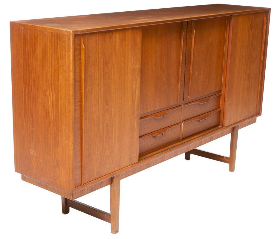 Danish Mid-Century Sideboard: Danish Mid-Century sideboard, 2-sliding doors, 2-doors open to mirrored and fitted interior, stretchered legs 44.5" tall x 76.5" wide x 17" deep State-wide delivery is available for this item. Please 