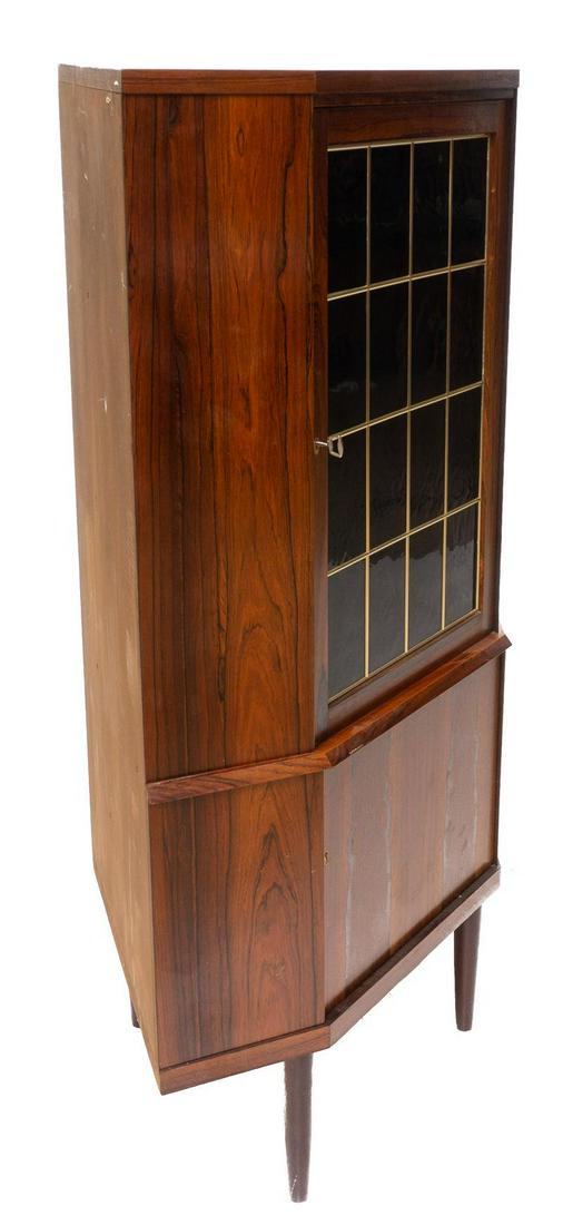 Mid-Century Corner Cabinet: Mid-Century corner cabinet, pin legs, single-glass door opens to shelved interior, single-wooden door, includes key 55" tall x 33.5" wide x 21.5" deep State-wide delivery is available for this item. P