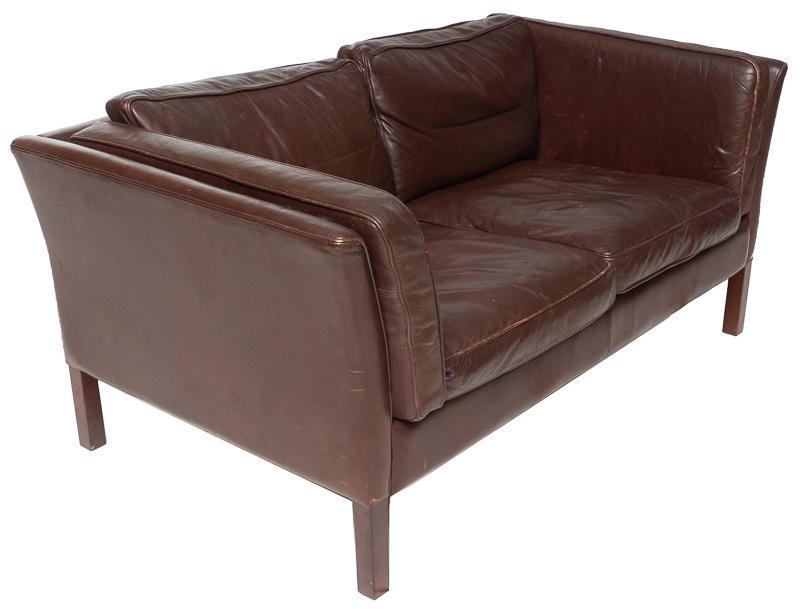 Danish Mid-Century Leather Sofa: Danish Mid-Century leather sofa, wooden legs, 2-seat 27" tall x 58" wide x 32" deep State-wide delivery is available for this item. Please email shipping@vogtauction.com or call 210-822-6155 for a quo