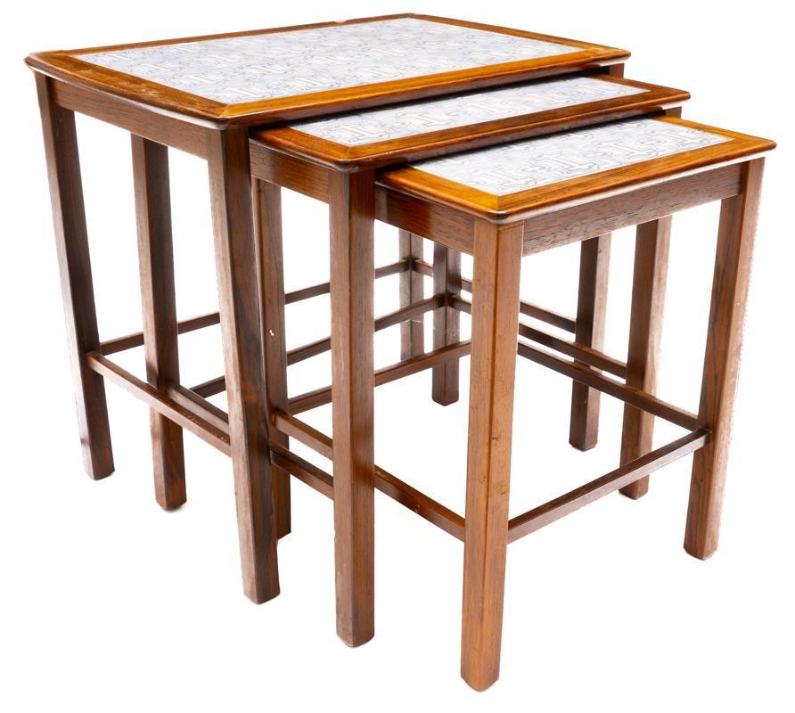 Nest of 3 Mid-Century Tile Top Tables: Nest of 3 Mid-Century tile top tables, grey abstract motif, stretchered legs, wooden frame 19" tall x 21.5" wide x 15" deep/ Largest