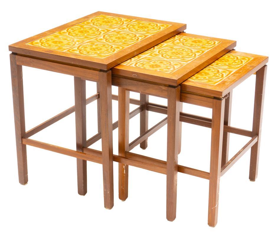 Nest of 3 Mid-Century Tile Top Tables: Nest of 3 Mid-Century tile top tables, stretchered legs, floral motif 20" tall x 21" wide x 15" deep/ Largest State-wide delivery is available for this item. Please email shipping@vogtauction.com or c