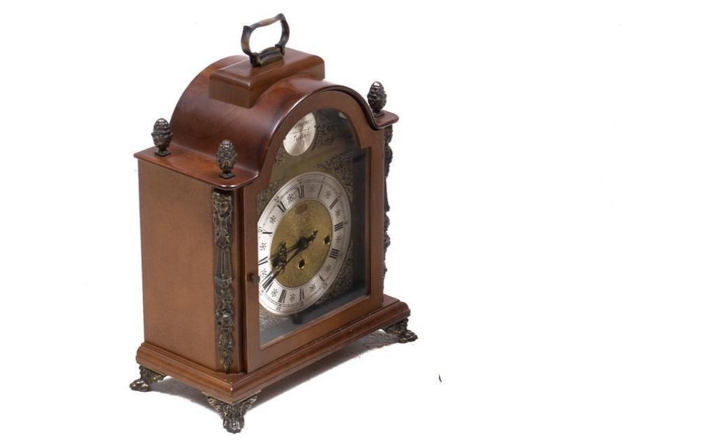 Vintage Table Clock: Provenance: A Prominent Alamo Heights, TX Estate Vintage table clock, handled, metal hardware, closed encasement, includes keys 16"h x 12"w x 6.5"d/ largest