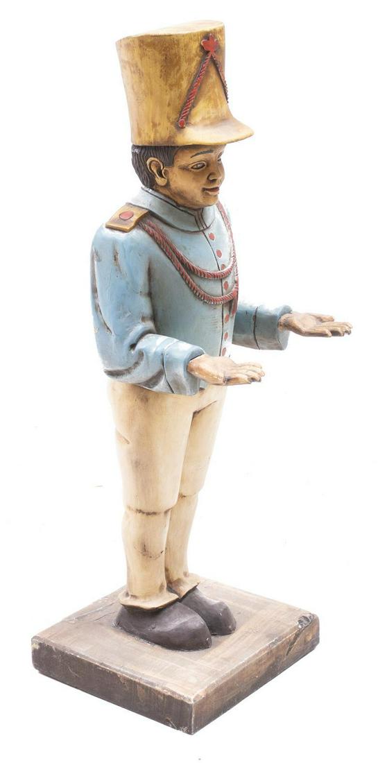 Painted Wooden Butler Table, Marching Drummer: Butler table, marching drummer, painted, wooden 36"h x 12"w x 14"d Condition: Does not include tray State-wide delivery is available for this item. Please email shipping@vogtauction.com or call 210-82