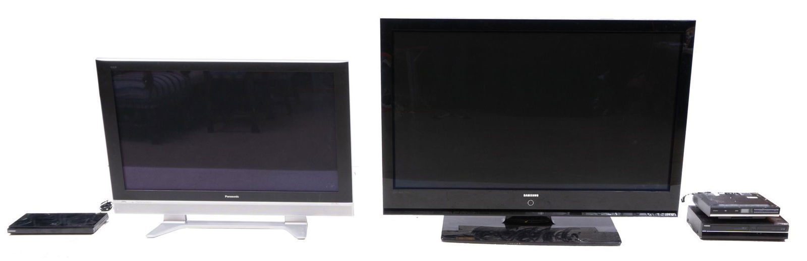 Pair of Televisions incl. VCR and DVD Players: Provenance: A Prominent Alamo Heights, TX Estate Pair of televisions incl. VCR and DVD players, Panasonic, Toshiba, and Samsung brands, bluray, wired American, does not include remote controls, TVs po