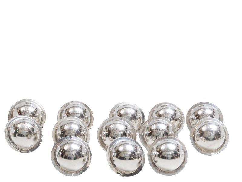 Set of 13 Neiman Marcus Sterling Christmas Ornaments: Provenance: The Estate of Mary Ann Delmer, San Antonio, TX Set of 13 Neiman Marcus sterling silver Christmas ornaments, etched, some dated, all stamped 7"d/ each