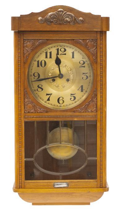Vintage Regulator Wall Clock: Vintage Regulator wall clock, closed wooden case, includes pendulum, carved mantle 29"h x 15"w x 6.5"d State-wide delivery is available for this item. Please email shipping@vogtauction.com or cal