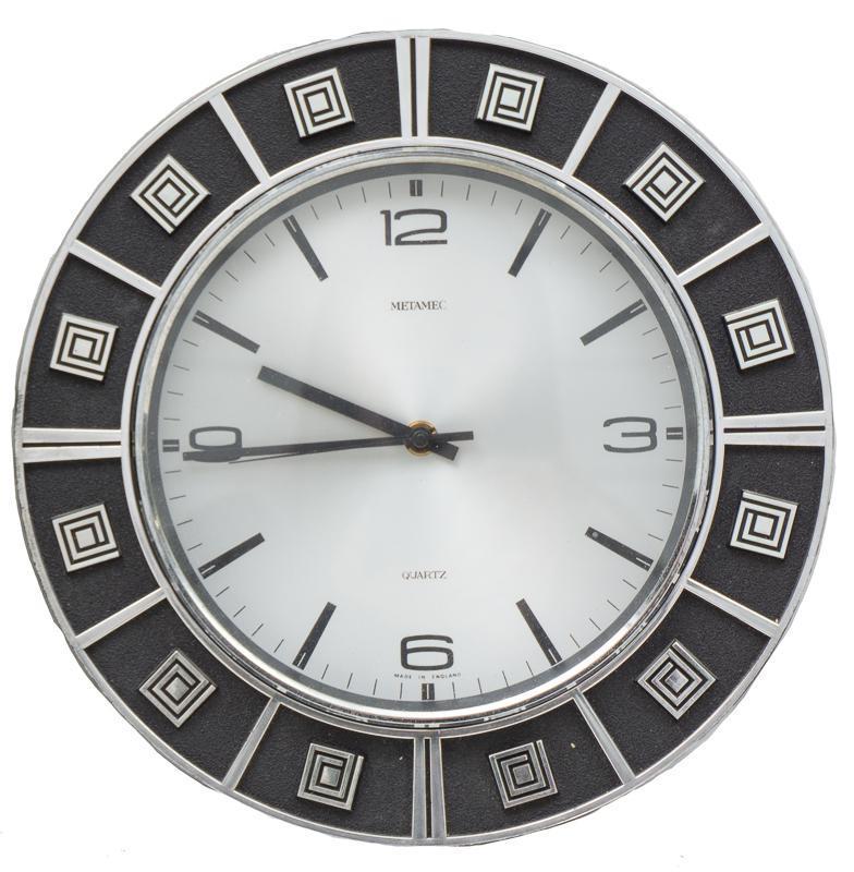 Mid-Century Chrome Metamic Clock: Mid-Century chrome Metamic wall hanging clock, geometric motif 12"h x 12"w