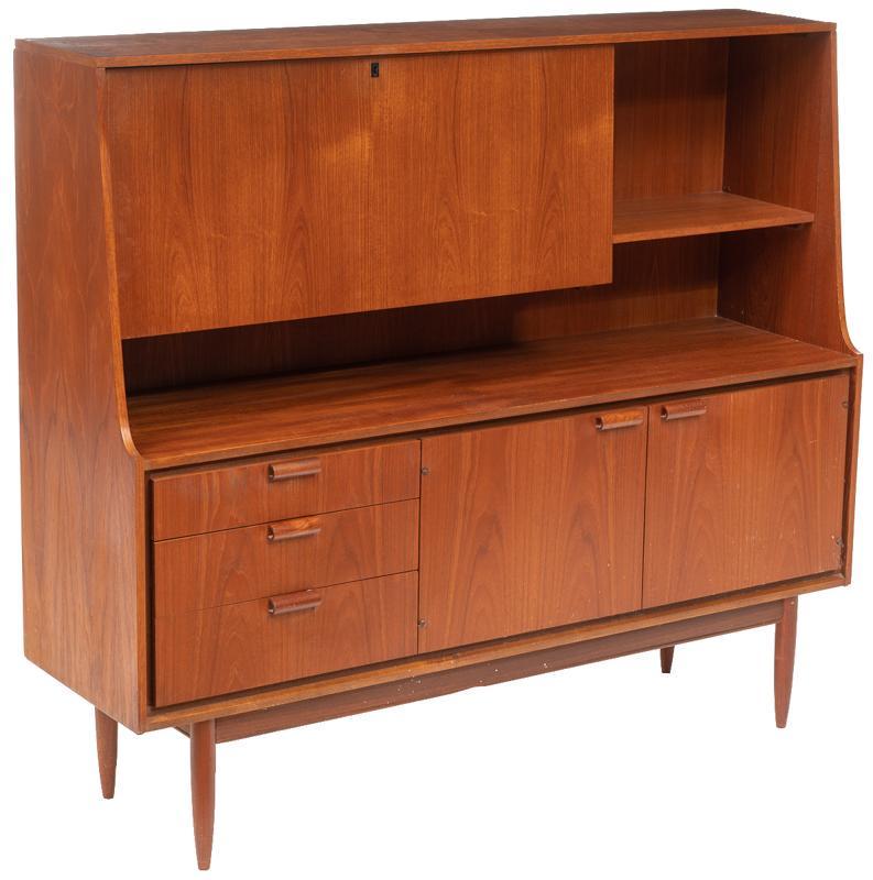 Mid-Century Sideboard: Mid-Century sideboard, pin legs, 2-doors and single-drop front door open to shelved interior, 3-drawers 53"h x 60"w x 18"d State-wide delivery is available for this item. Please email shipping@vogtauc
