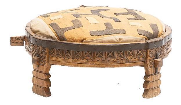 Thai-Style Burlap Foot Stool: Thai-style foot stool, burlap patterned top, raised on carved wooden base 10"h x 30"d State-wide delivery is available for this item. Please email shipping@vogtauction.com or call 210-822-6155 for a q