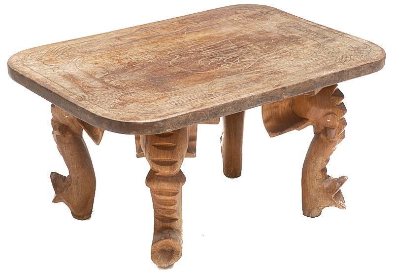 Thai-Style Coffee Table, Eagle and Elephant: Thai-style coffee table, eagle and elephant motif, carved top, elephant trunk shaped legs 17"h x 34"w x 22"d State-wide delivery is available for this item. Please email shipping@vogtauction.com or ca